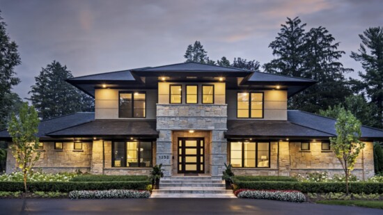 Chiseled quarry limestone, stucco and steel are in perfect balance in the home’s luminous exterior. Photo by Martin Vecchio.