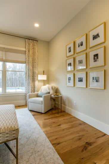 This family photo wall gives life to dozens of memories while sticking to a clean design aesthetic.