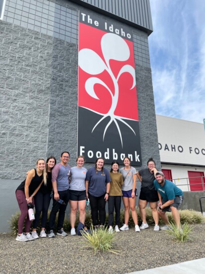 Volunteers from the Idaho College of Osteopathic Medicine (ICOM) pose for a shot outside after their volunteer shift.