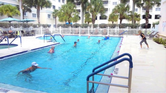 Instructor Sherry Brown leads an exercise class at the Jacaranda Trace pool.