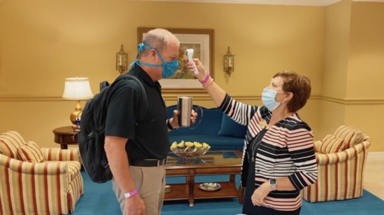 Ken Gustafson and Josie Cutsinger, Security, conducting a routine temperature check