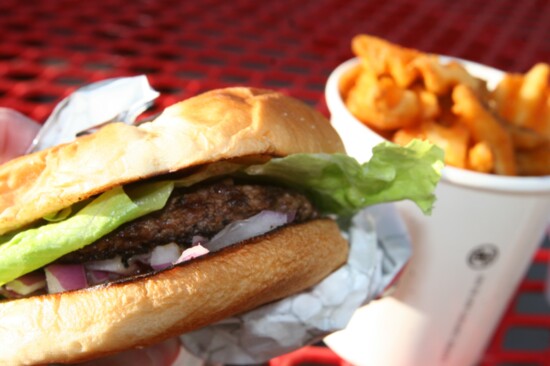 Fanci Freez's huckleberry burger and seasoned waffle fries.